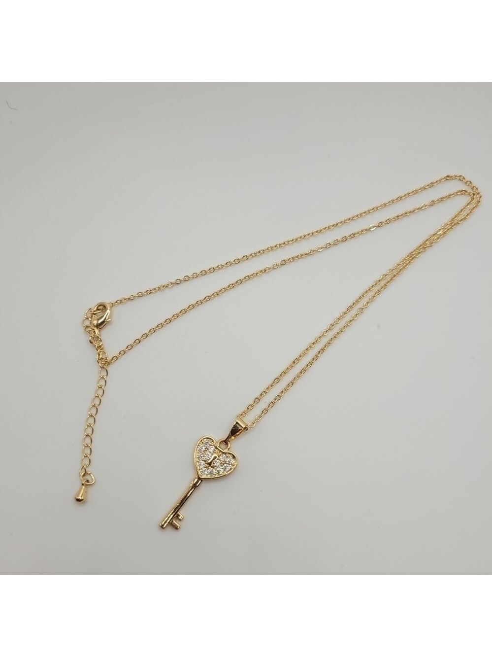 Gold Toned Cubic Zirconia Key Necklace